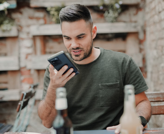 man using guest network to while on cellphone